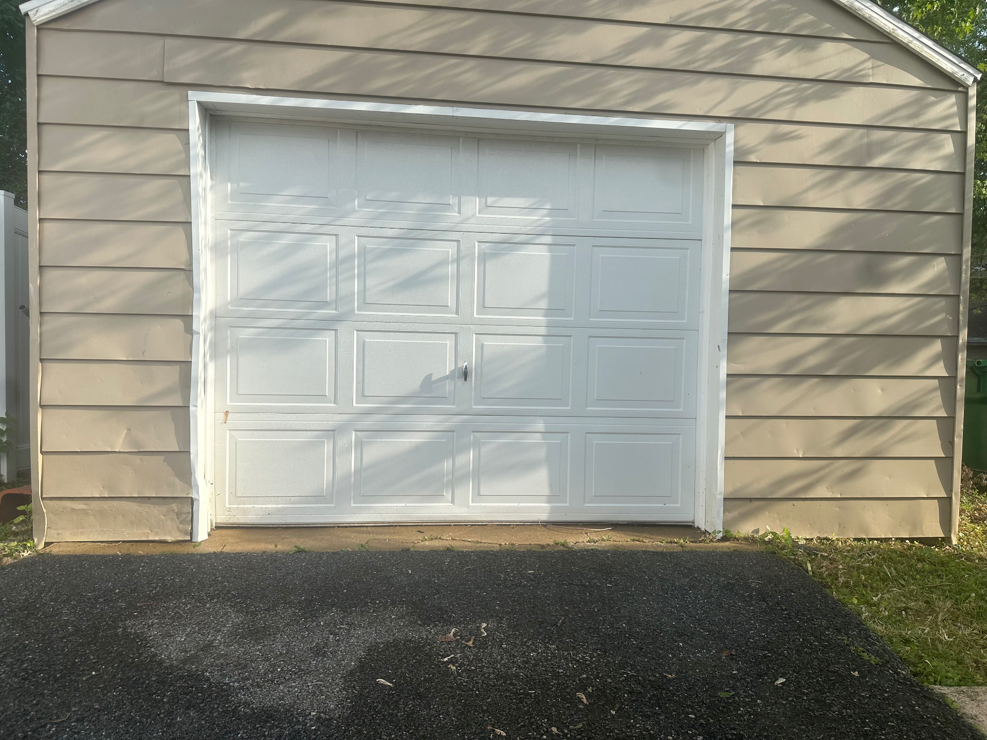 Clean garage door after pressure washing